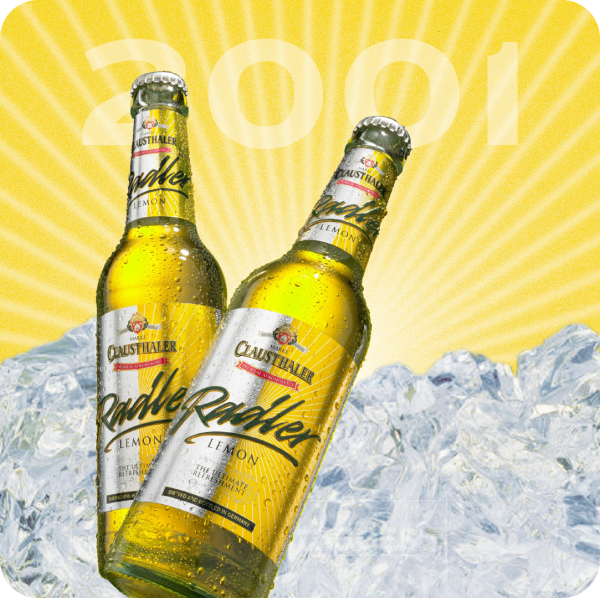Two bottles of lemon-flavored drink are shown against a backdrop of icy mountains and radiant sunrays.